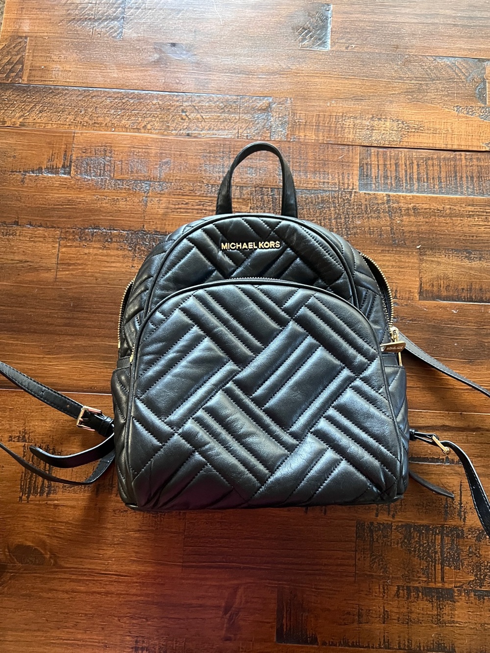 Michael Kors Black Quilted Chevron Backpack with Gold Hardware